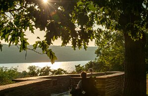 book A lady reading a book on a quiet Summer afternoon over looking Cayuga Lake, the second largest of New York's Finger Lakes!